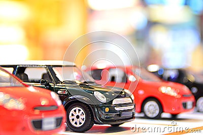 Classic mini model with modern car Stock Photo