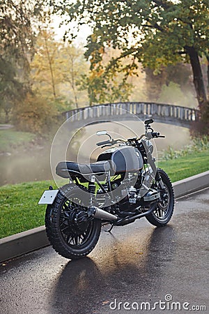 A classic motorcycle parked on asphalt Stock Photo