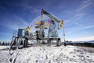 Classic oil pump in the mountains, UK flag, Great Britain Stock Photo