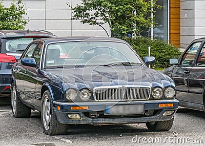 Classic old dark blue Jaguar sedan front side view Editorial Stock Photo