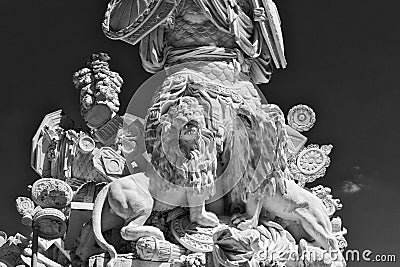 classic old Greek style white stone sculpture detail of warrior with lions at his feet at the Schonbrunn palace Editorial Stock Photo
