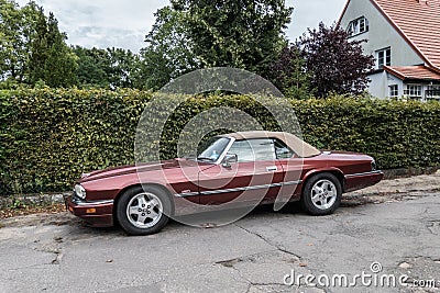 Classic old purple red Jaguar convertible left side view Editorial Stock Photo