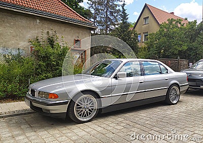 Classic old sedan car BMW 750 V12 front part and left side view parked Editorial Stock Photo