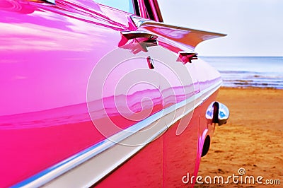 Classic pink Cadillac at beach Stock Photo