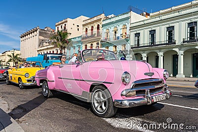 Classic pink convertible car on a tour of old Havana. Cuba. Editorial Stock Photo