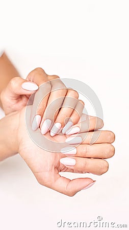 Classic pink wedding nail manicure on white backdrop. Spa treatment concept Stock Photo