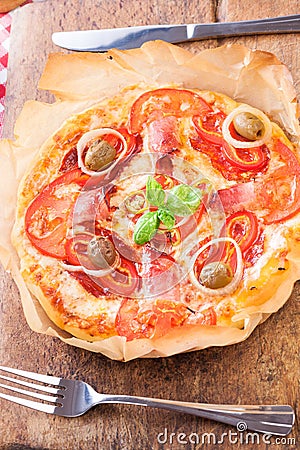 Classic pizza served on paper Stock Photo