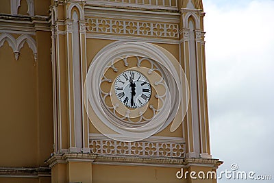 Classic pointer clock in church tower Stock Photo