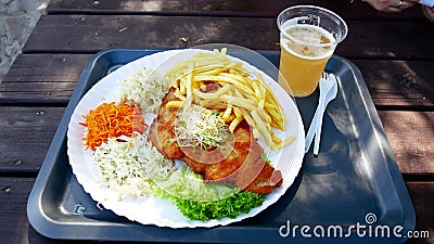 Classic polish dinner - pork filet salad set french fries and a beer Stock Photo