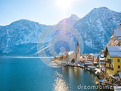 Classic postcard view of famous Hallstatt lakeside town in the Alps moutain ship on a beautiful cold Stock Photo