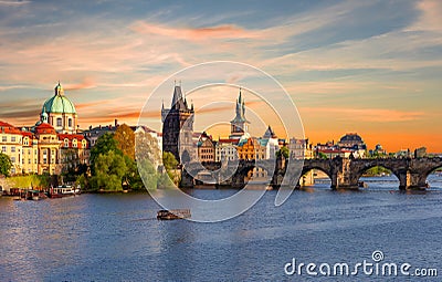 Classic Prague panorama with Old Town Bridge Tower and Charles bridge over Vltava river at sunset, Czech Republic Stock Photo