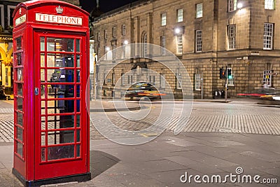 Classic red British telephone box, night scene Stock Photo