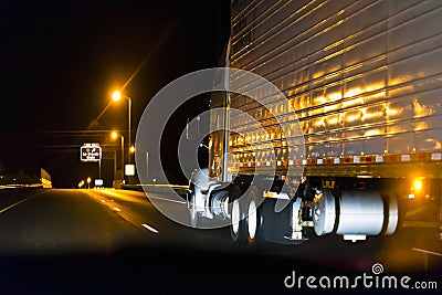 Classic semi truck on the high way in night Stock Photo