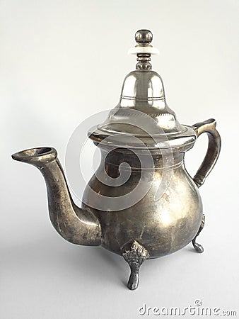 Classic silver arabic teapot isolated on white background. Close up of Old Moroccan teapot Stock Photo