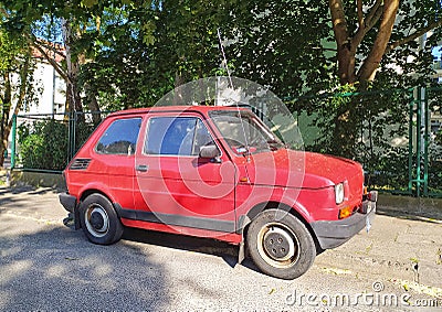 Classic small red Polish car Polski Fiat 126p dparked Editorial Stock Photo