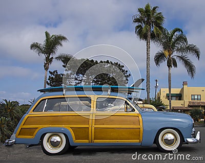 Classic surfer woody car with surfboard, near Encinitas CA Stock Photo