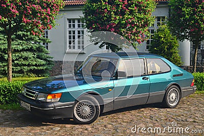 Classic old Swedish veteran vintage historic oldtimer famous metal green car Saab 900 parked Editorial Stock Photo