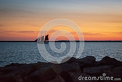 Classic tall ship at sunset Stock Photo