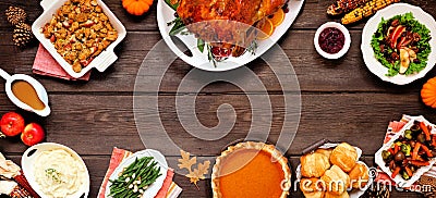 Classic Thanksgiving turkey dinner. Top view frame on a dark wood banner background. Stock Photo