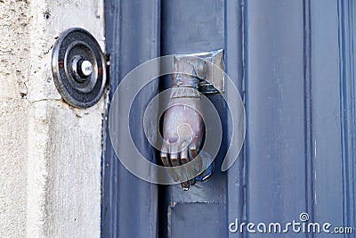 Classic traditional rustic heavy cast brass doorbell button and brass Door Handle Hand Shape bell vintage style Stock Photo