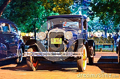 Classic trucks and cars around the plaza in Santa Fe New Mexico leading up to Zozobra Editorial Stock Photo