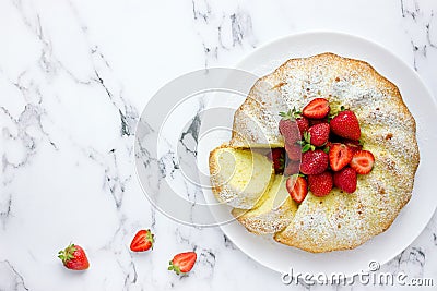 Classic vanilla bundt cake with strawberries Stock Photo