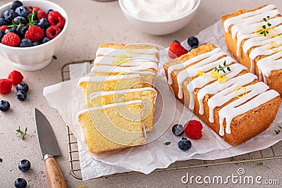 Classic vanilla pound cake with powdered sugar glaze sliced on parchment Stock Photo