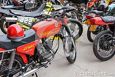 Classic Vespa, zundapp, Famel XF, Piaggio, and Sachs V5 motorcycles on display on a street Editorial Stock Photo