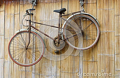 Bike decoration hanging ropes bamboo wall, Mai Chau, Vietnam Stock Photo