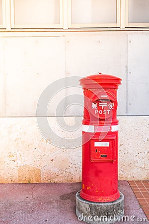 Classic vintage Japanese style postbox with cement wall background Editorial Stock Photo