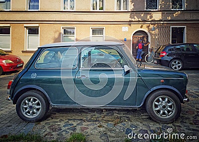 Old classic vintage car small green Morris Mini Cooper parked Editorial Stock Photo