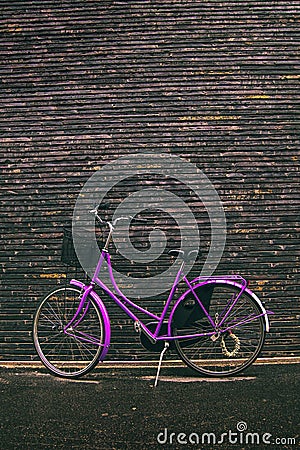 Classic Vintage Purple Hipster Bicycle on the Street Stock Photo