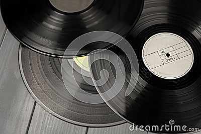 Classic vinyl records on gray wooden table Stock Photo
