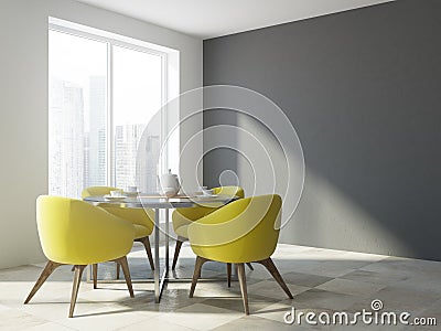Yellow chair dining room interior, gray wall Stock Photo