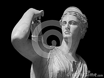 Classic white marble statuette Diana of Versailles isolated on black background. Scilpture of huntress Stock Photo