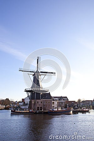Classic windmill at canal Stock Photo