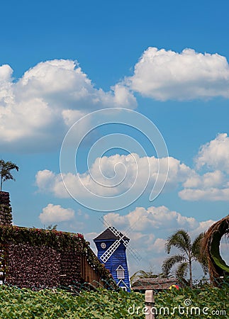 Classic Windmill on a garden Stock Photo