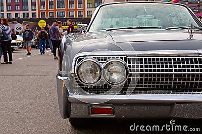 Classical American Vintage car 1961 Lincoln Continental limousine. Detail of front light Editorial Stock Photo