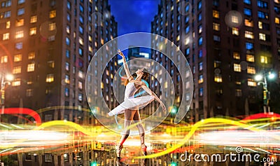 Classical ballet dancer dancing on city road Stock Photo