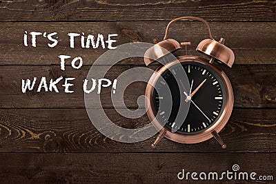 Classical copper colored alarm clock with bells in a Wake Up concept Stock Photo