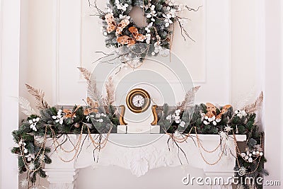 Classical fireplace decorated with tree branches. Horizontal Stock Photo