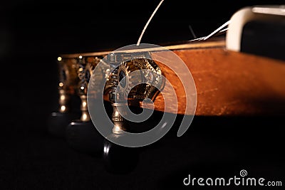 Classical guitar on black background. Acoustic guitar concept.Perfect for flyer, card, poster or wallpaper Stock Photo