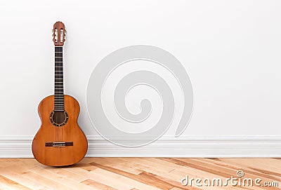 Classical guitar in an empty room Stock Photo