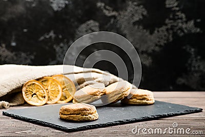 classical Italian fresh delicious homemade raisin scones on table, dark background Stock Photo