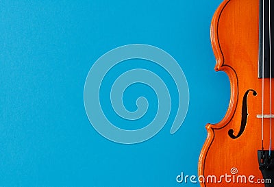 Classical music concert poster with orange color violin on blue background with copy space Stock Photo