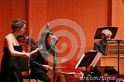 Classical music. Violinists in concert. Stringed, violinist.Closeup of musician playing the violin during a symphony Editorial Stock Photo