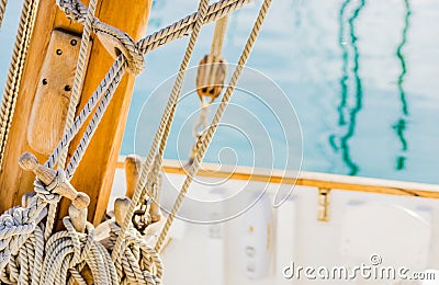 Classical sailing boat deck with rigging nautical ropes on wooden mast Stock Photo