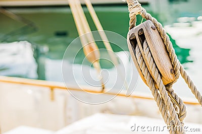 Classical sailing yacht deck, rigging wooden pulley and nautical ropes Stock Photo
