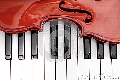 classical violin on white and black piano keys close-up background Stock Photo