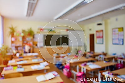 Classroom in a blurred background with no children. Students left their backpacks and notebooks and went on a break Stock Photo